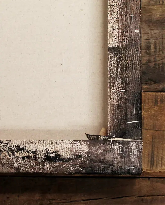 Back of an oil painting stretched on a wooden frame with staples